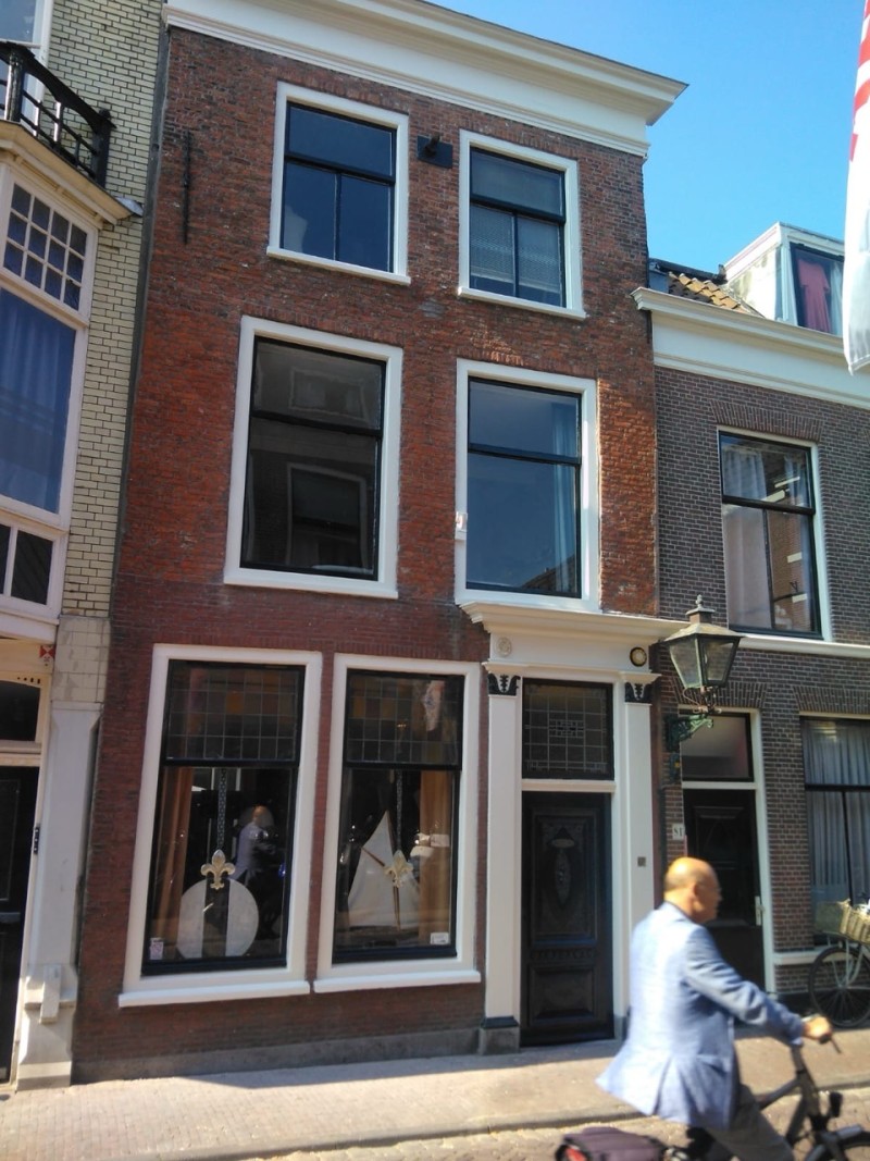 A lone surfer in the waves near the beach